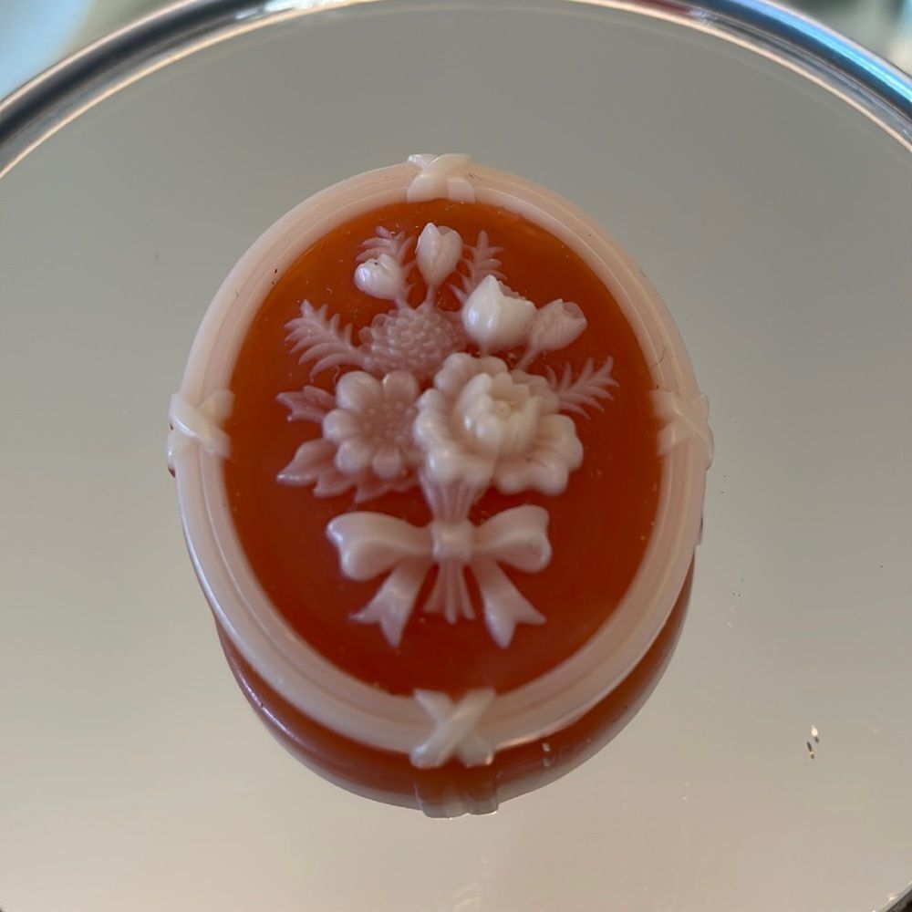 Vtg Avon plastic celluloid look orange &‎ white floral brooch